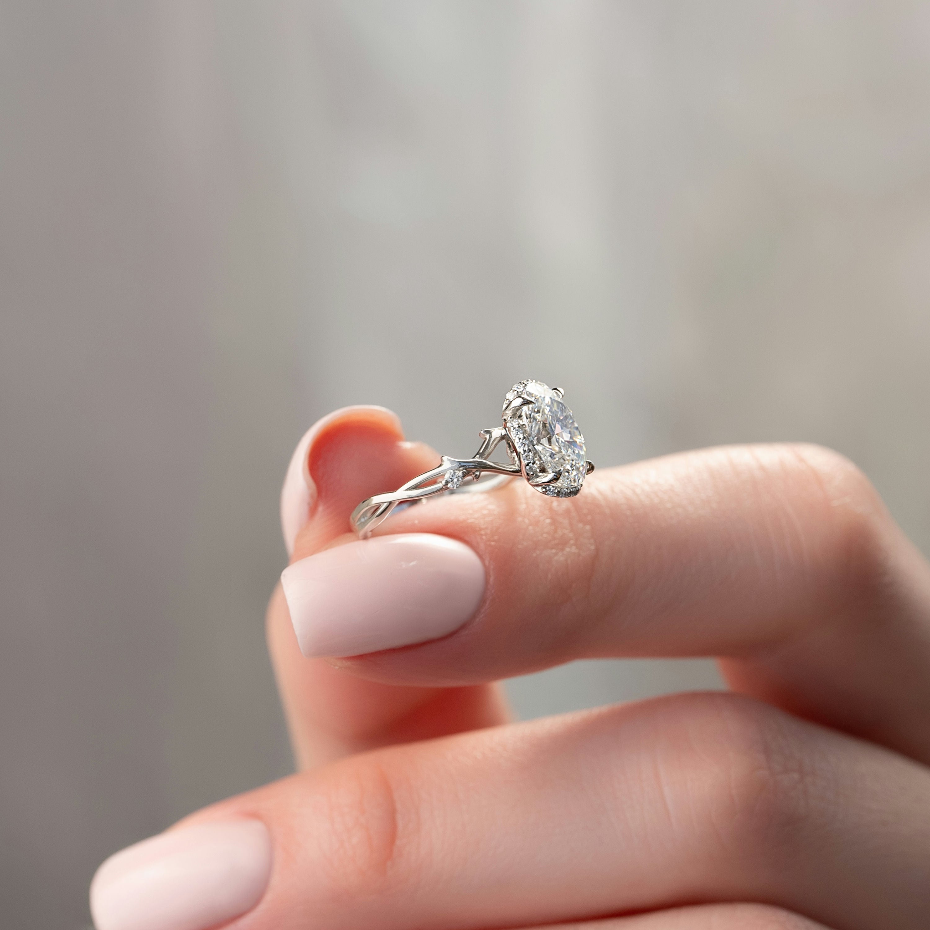 Aurora Halo 1.50 Carat VVS1 Lab‑Grown Oval Halo Engagement Ring in 18K White Gold Closeup Side View