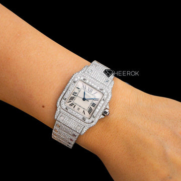 Cartier Santos White Dial Roman Numerals Diamond Bezel Bust Down Moissanite Diamond Watch For Women On Wrist View.