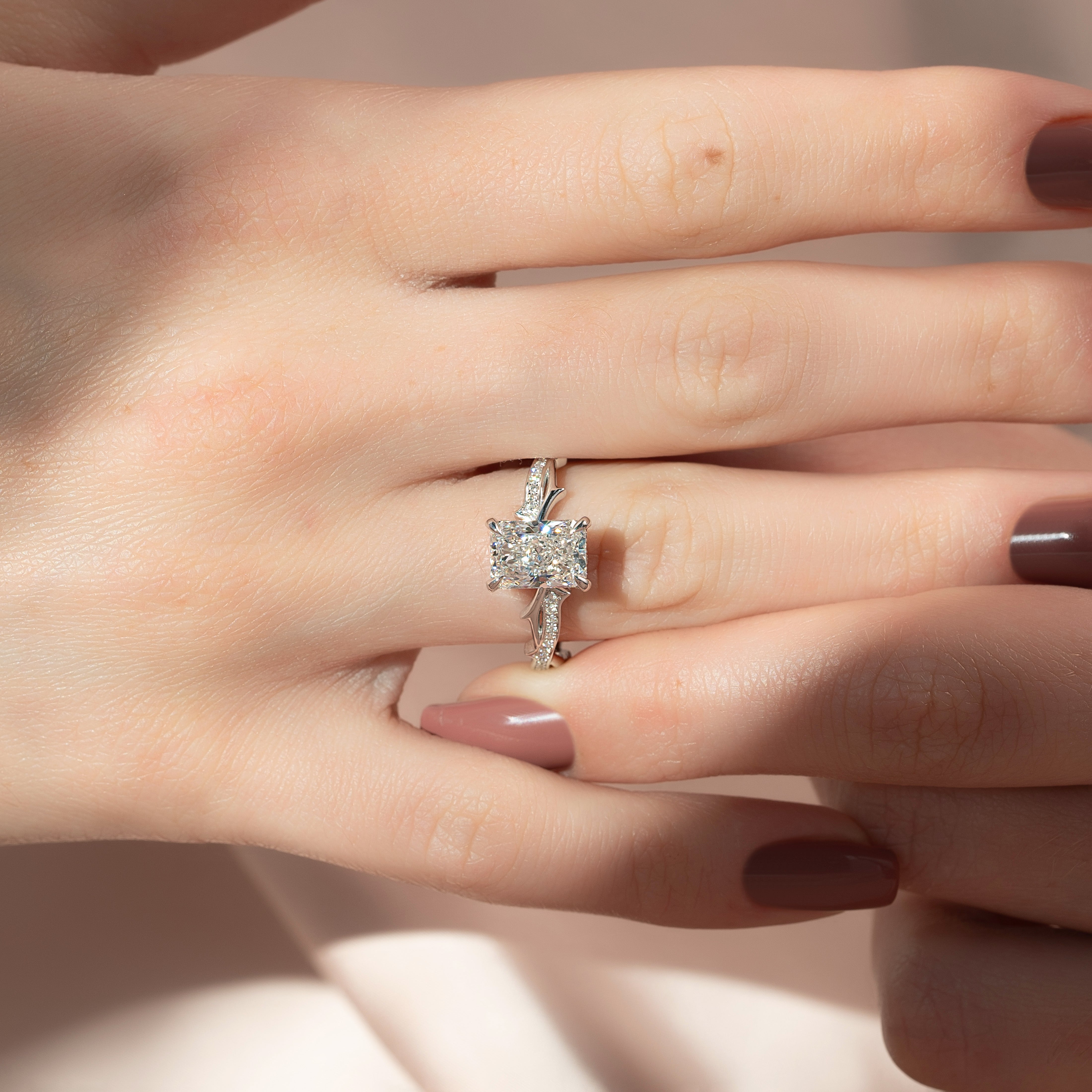 Celestia Arc 2.26 Carat VVS Lab-Grown Radiant Three Stone Pavé Engagement Ring in 18K White Gold Finger View