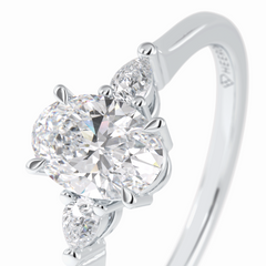Celestial Harmony 1 Carat Oval VVS1 Moissanite Three Stone Engagement Ring in 18K White Gold