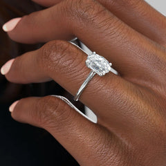 Divine Allure 2.01 Carat VVS1 Lab-Grown Oval Solitaire With Accents Engagement Ring in 18K White Gold Finger Front View