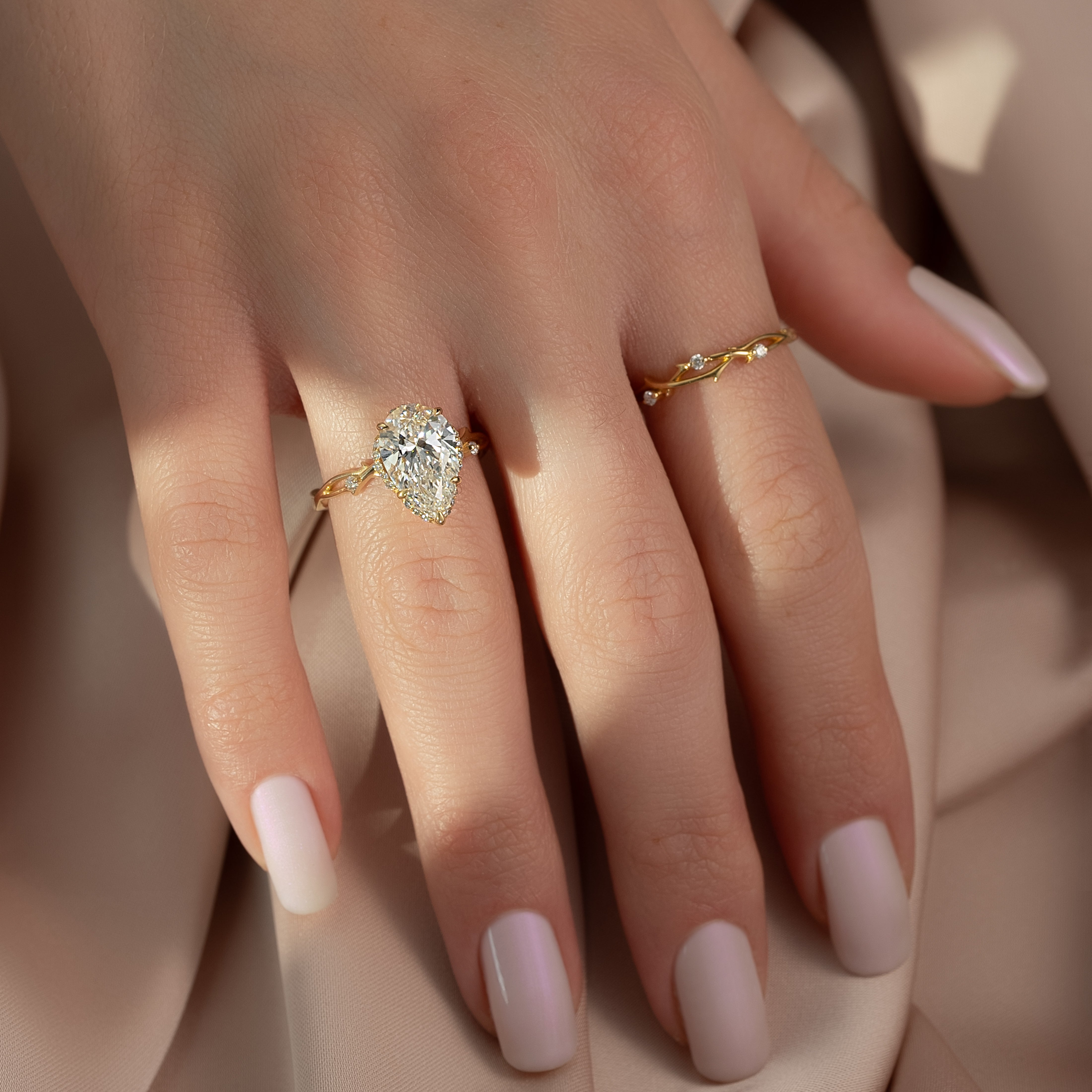 Divine Gleam 2  Carat VVS1 Lab‑Grown Pear Halo Engagement Ring in 18K Yellow Gold Finger View 