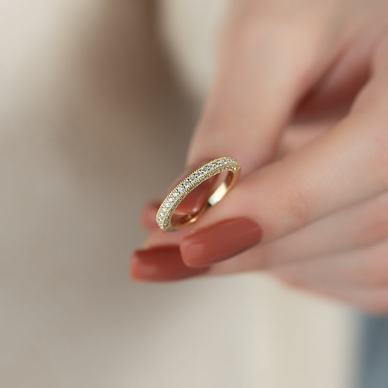 Elegant Halo VVS1 Lab-Grown Wedding Ring in 18K Yellow Gold On Finger Standing View