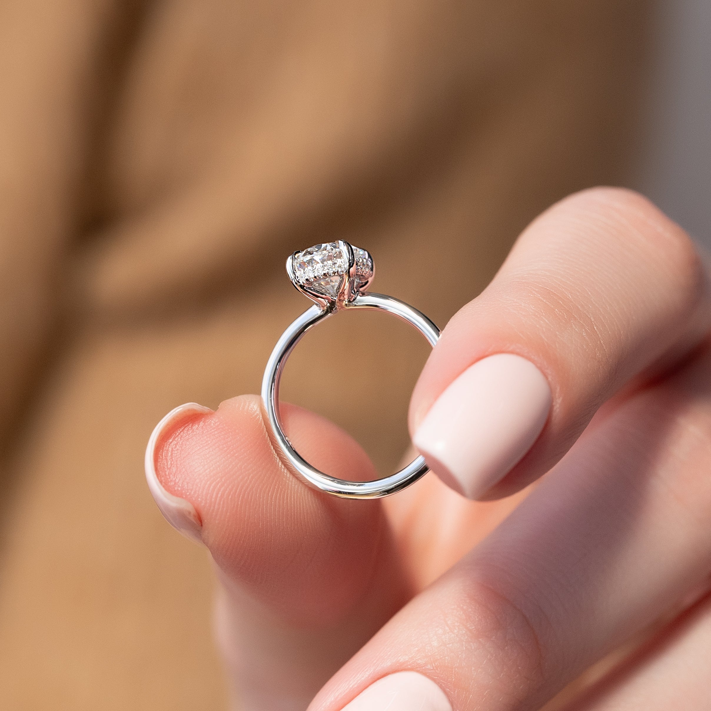 Elysian Oval 1.58 Carat VVS1 Lab-Grown Hidden Halo Engagement Ring in 18K White Gold Hand View