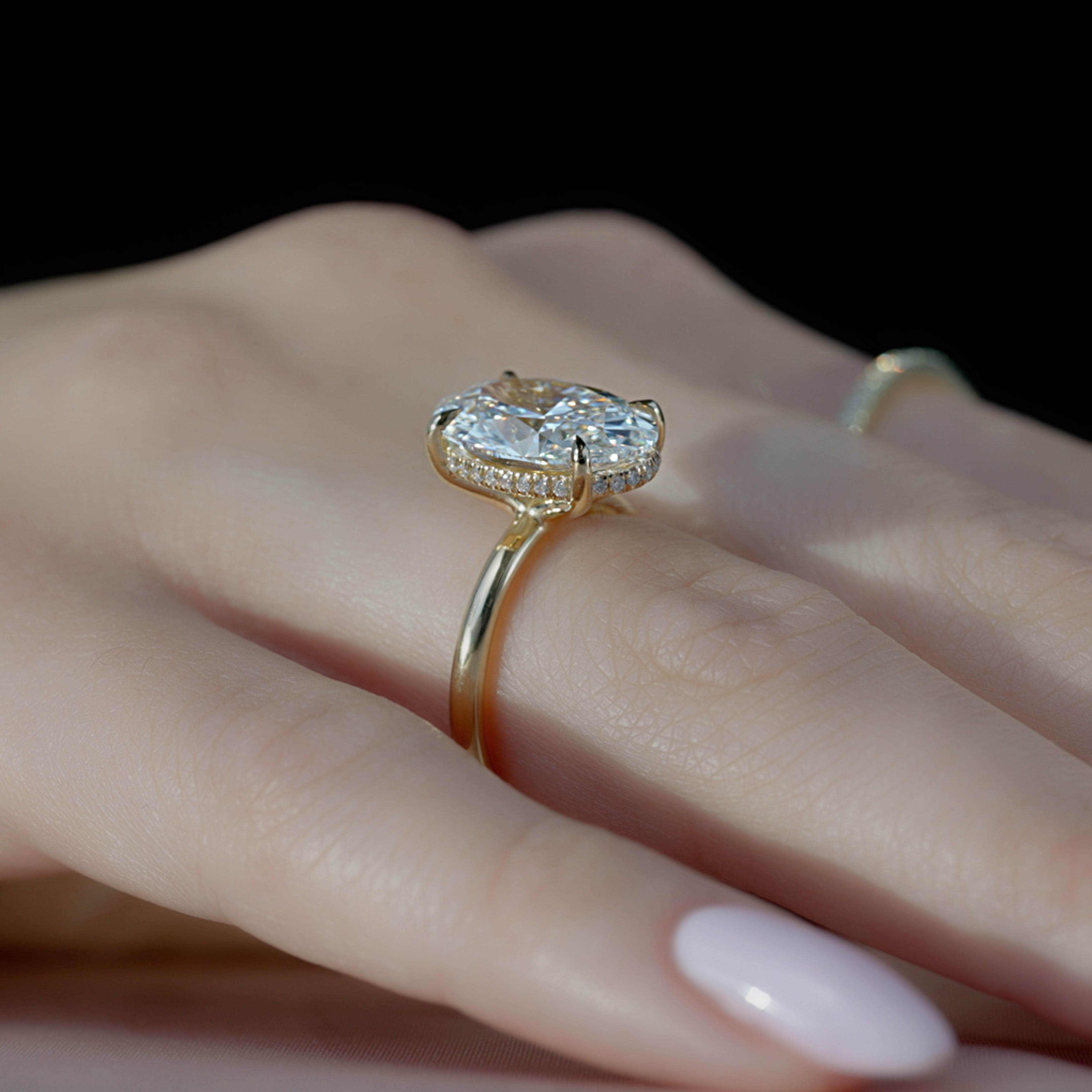 Elysian Oval 1.58 Carat VVS1 Lab-Grown Hidden Halo Engagement Ring in 18K Yellow Gold Finger Closeup View