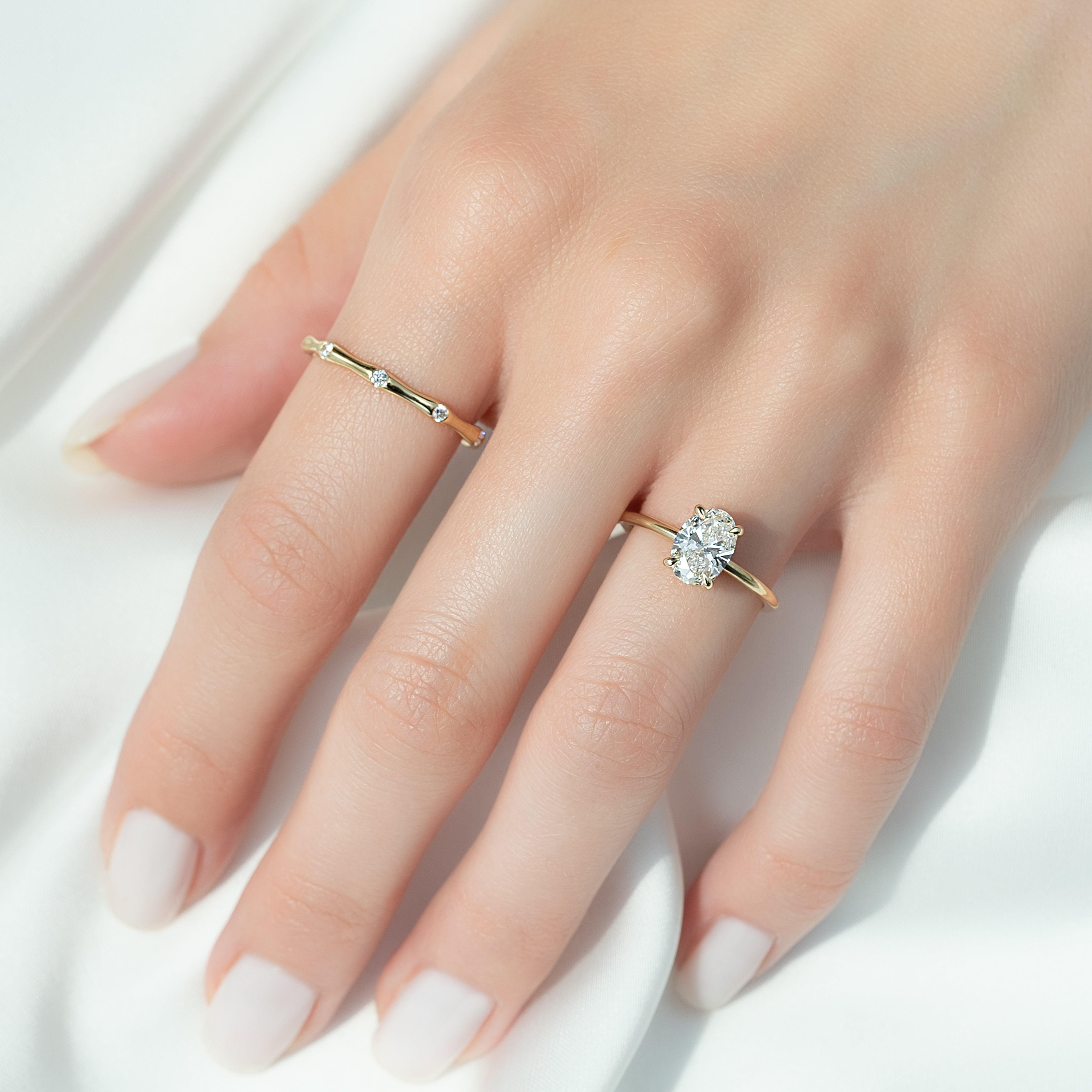 Elysian Oval 1.58 Carat VVS1 Lab-Grown Hidden Halo Engagement Ring in 18K Yellow Gold Finger View_1