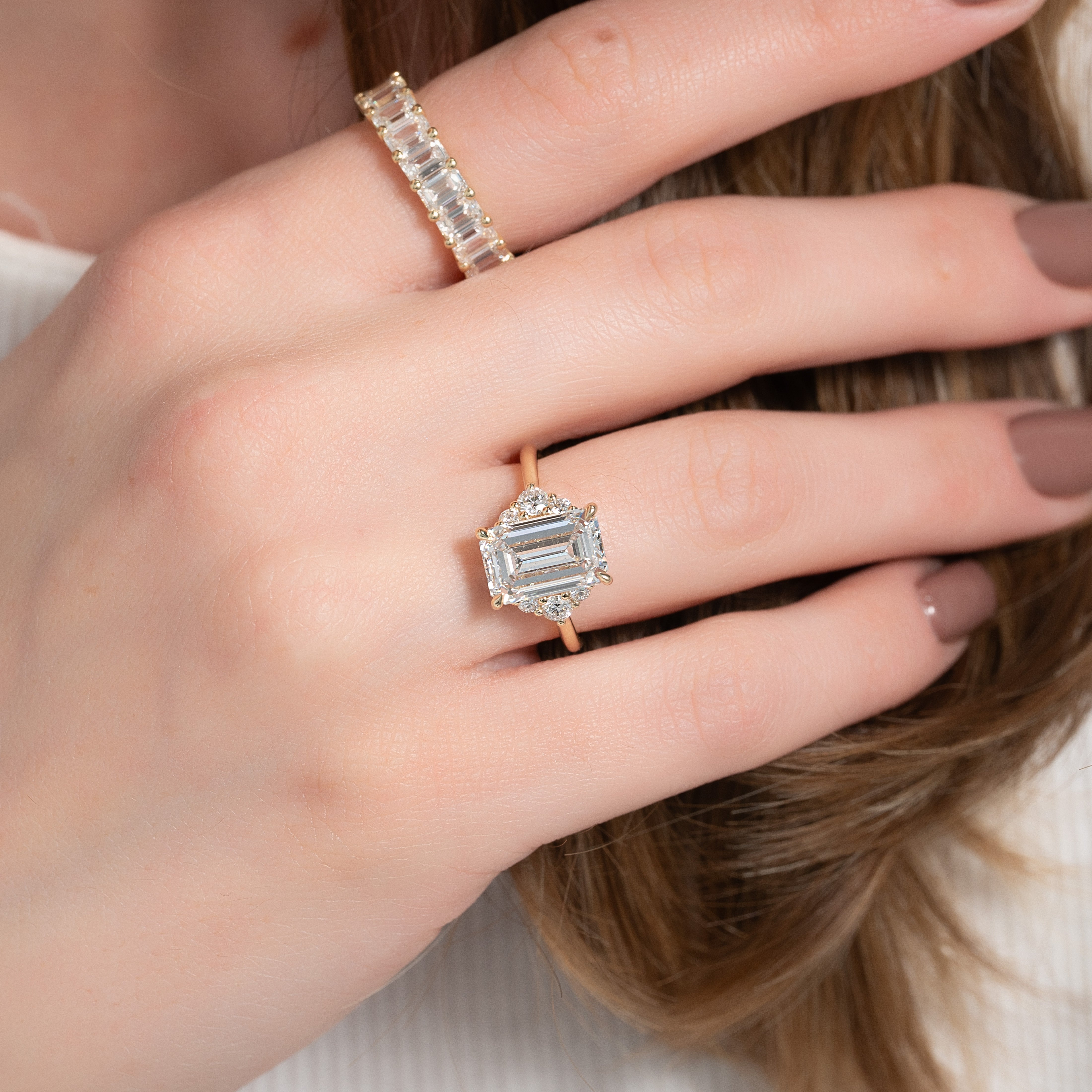 Eternal Prism 2 Carat VVS1 Lab-Grown Emerald Three Stone Engagement Ring in 18K Yellow Gold Finger View