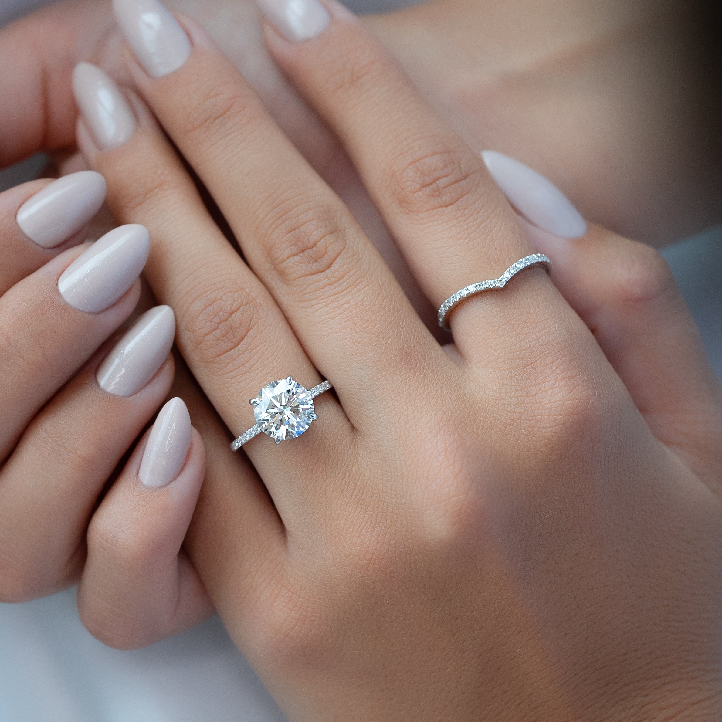 Eternal Spark 2.81 Carat VVS1 Lab-Grown Hidden Halo Pave Engagement Ring in 18K White Gold Hand View