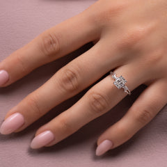 Eternal Weave 3.05 Carat VVS1 Lab-Grown Elongated Cushion Textured Three-Stone Engagement Ring in 18K White Gold Hand View