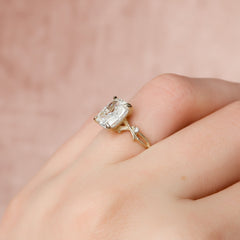 Eternal Weave 3.05 Carat VVS1 Lab-Grown Elongated Cushion Textured Three-Stone Engagement Ring in 18K Yellow Gold Finger View