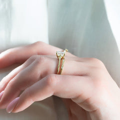 Gentle Wave VVS1 Lab‑Grown Half Eternity Wedding Ring in 18K Yellow Gold Closeup Finger View