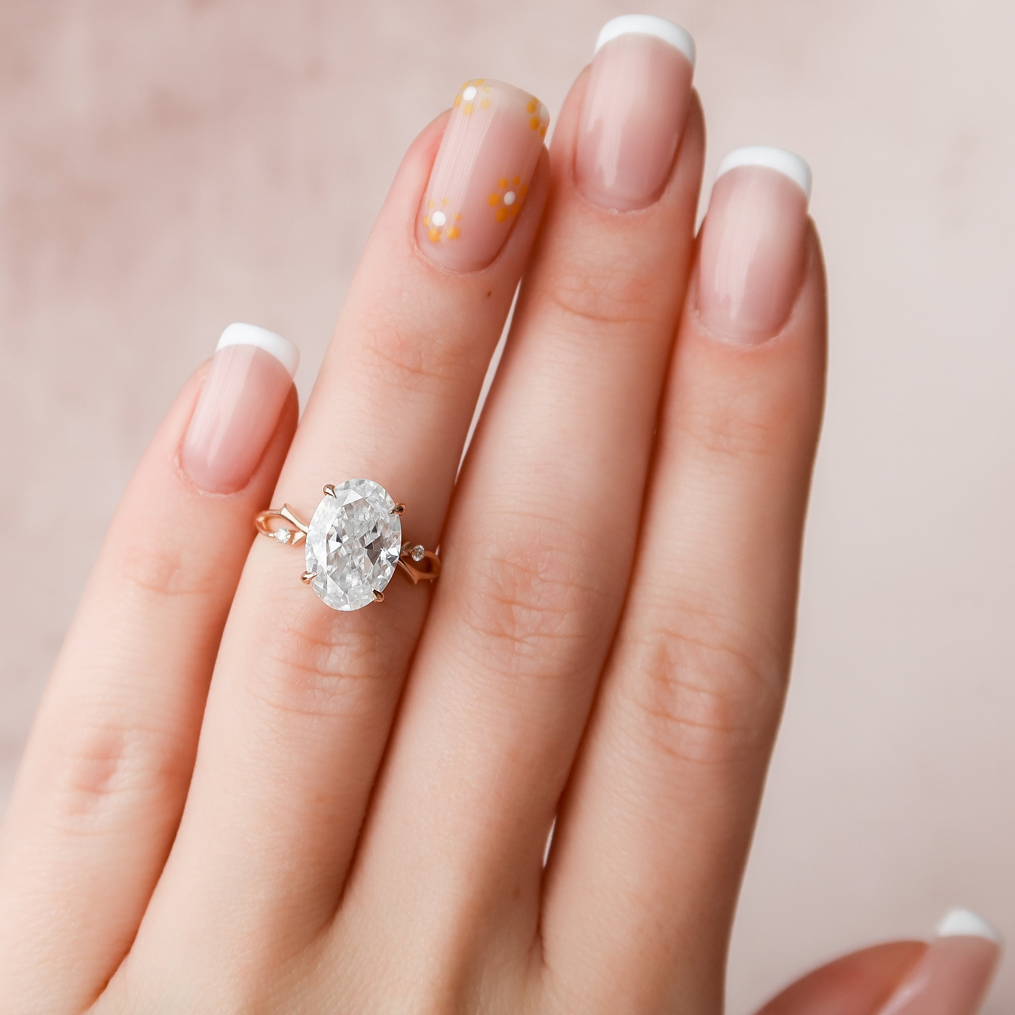 Lustrella 2.50 Carat Oval VVS1 Lab-Grown Three Stone Engagement Ring 18K Rose Gold Hand Full View