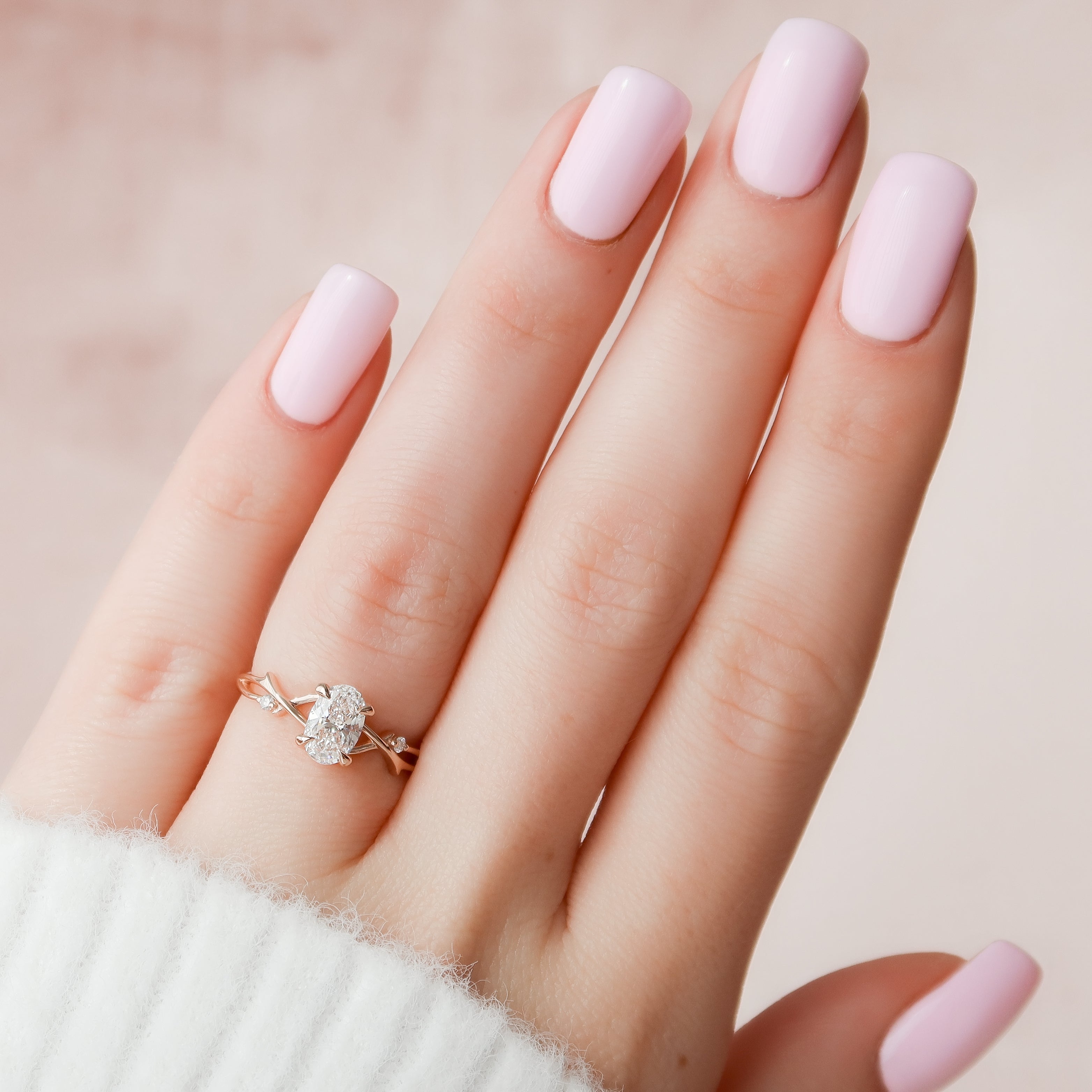 Lustrella 2.50 Carat Oval VVS1 Lab-Grown Three Stone Engagement Ring 18K Rose Gold Hand View