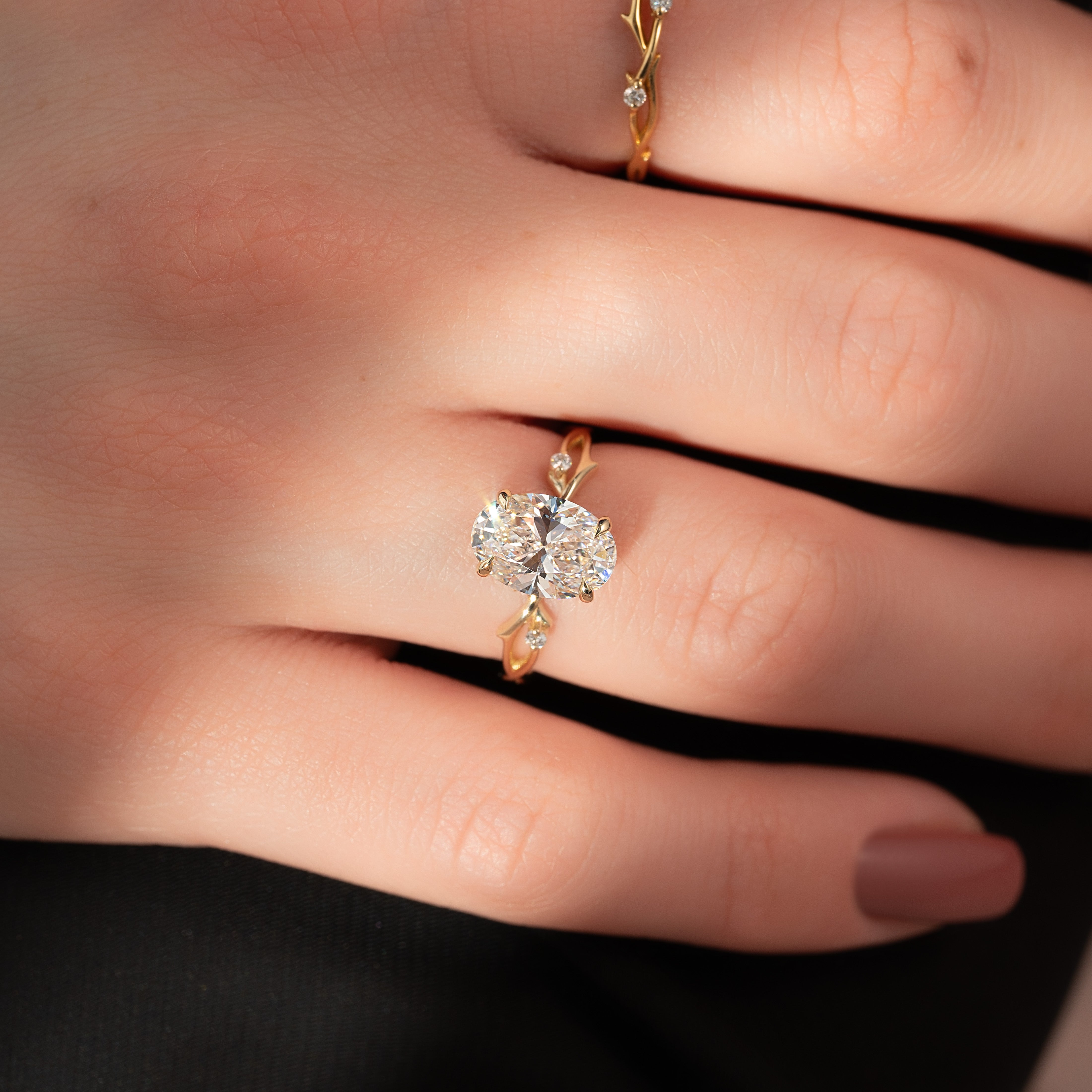 Lustrella 2.50 Carat Oval VVS1 Lab-Grown Three Stone Engagement Ring 18K Yellow Gold Finger Closeup View