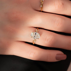 Lustrella 2.50 Carat Oval VVS1 Lab-Grown Three Stone Engagement Ring 18K Yellow Gold Finger Closeup View