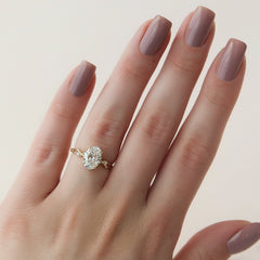 Lustrella 2.50 Carat Oval VVS1 Lab-Grown Three Stone Engagement Ring 18K Yellow Gold Finger View