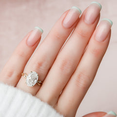 Lustrella 2.50 Carat Oval VVS1 Lab-Grown Three Stone Engagement Ring 18K Yellow Gold Hand View