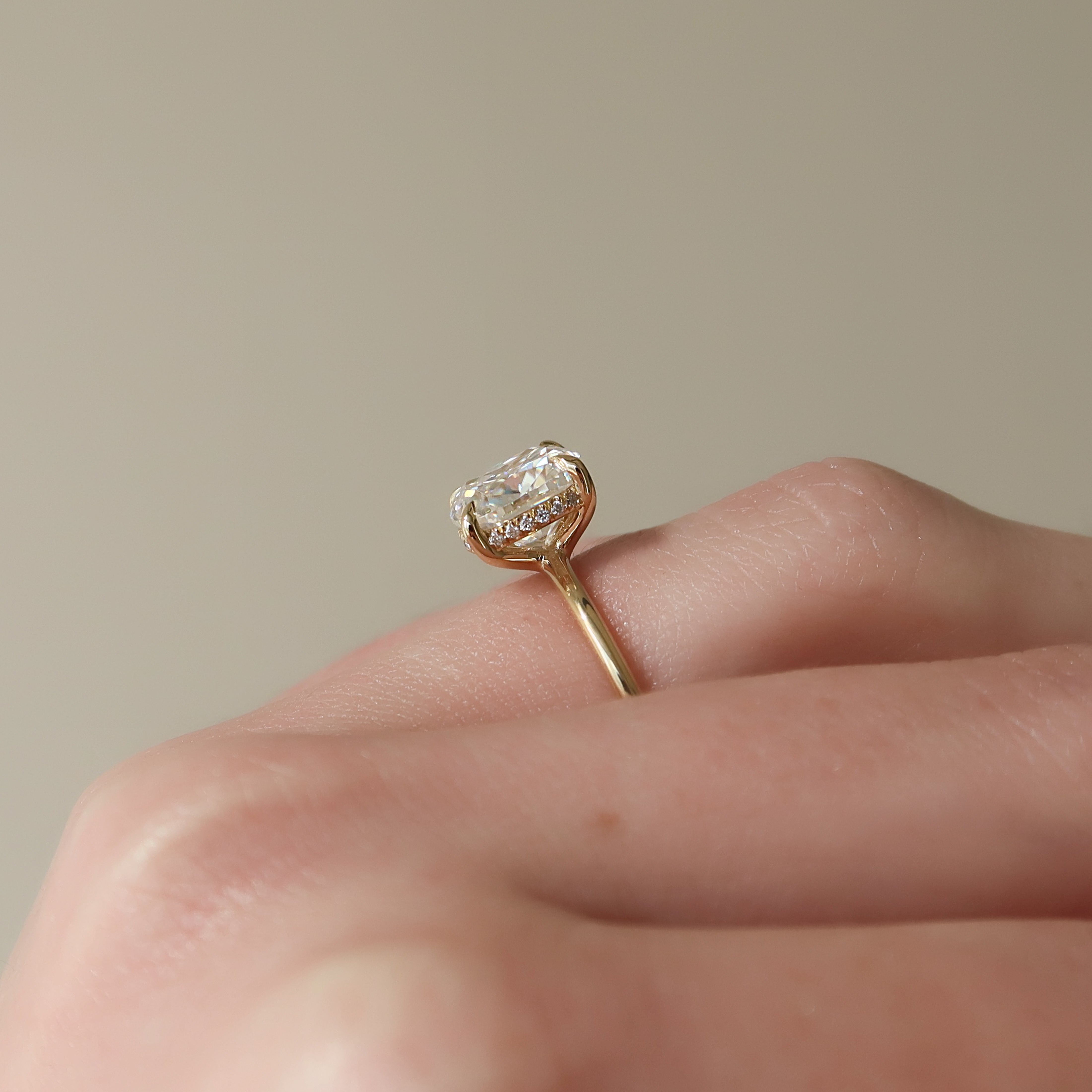 Luxe Blossom Cushion 1.55 Carat VVS1 Lab-Grown Hidden Halo Engagement Ring in 18K Yellow Gold Finger Closeup View