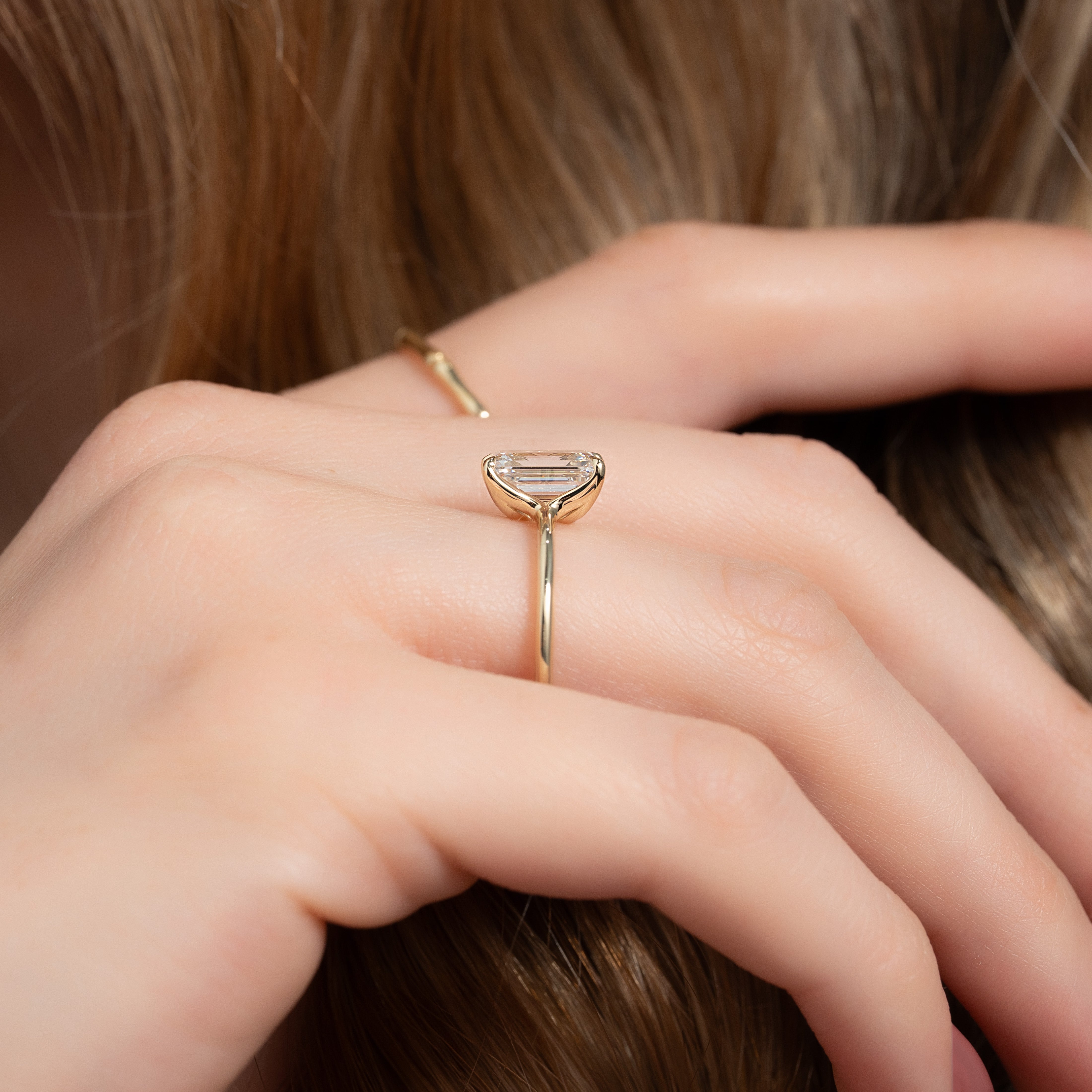 Majestic Empress 2.08 Carat VVS1 Lab‑Grown Emerald Solitaire Engagement Ring in 18K Yellow Gold Finger View