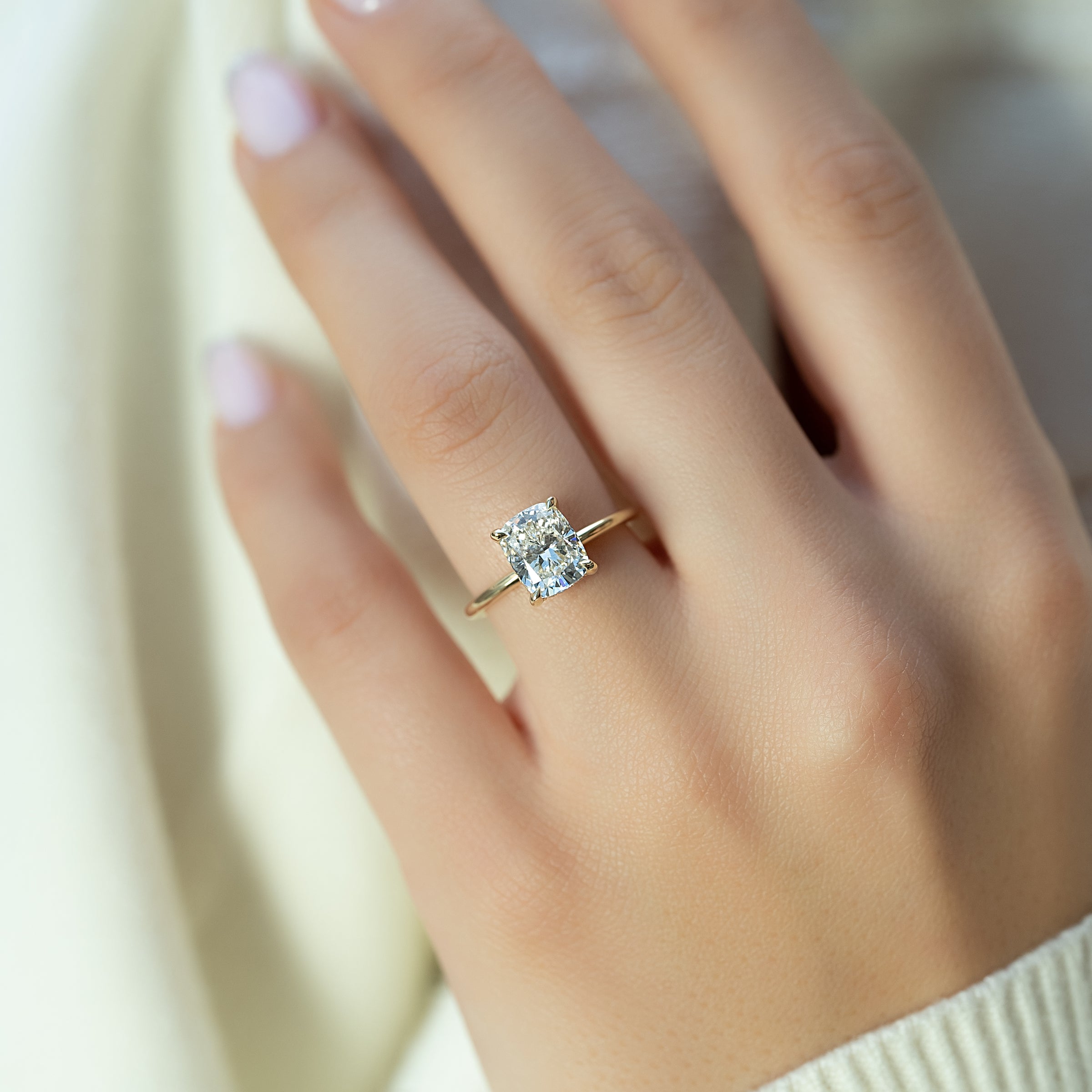 Mooncrest 3.05 Carat VVS Lab-Grown Elongated Cushion Hidden Halo Engagement Ring in 18K Yellow Gold Hand View