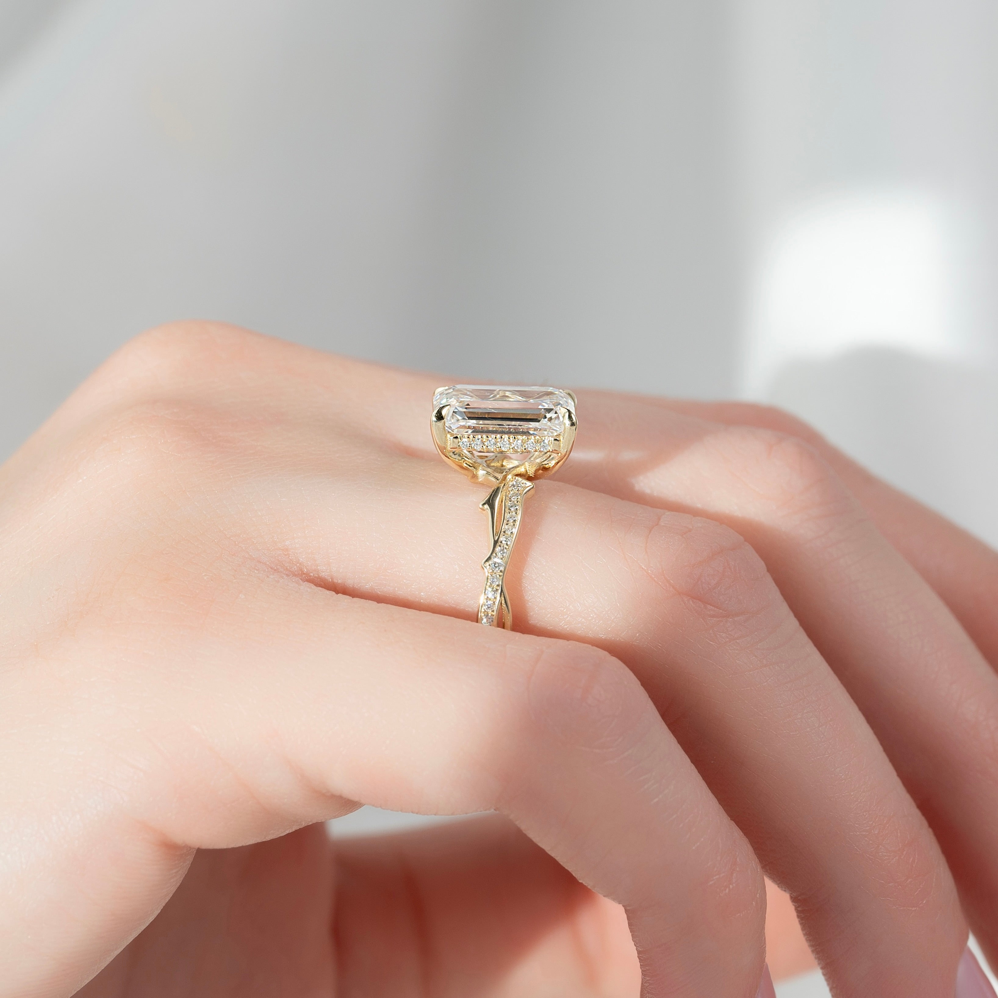 Moonlit 2.50 Carat VVS1 Lab-Grown Emerald Three-Stone Pave Engagement Ring in 18K Yellow Gold Finger Side View