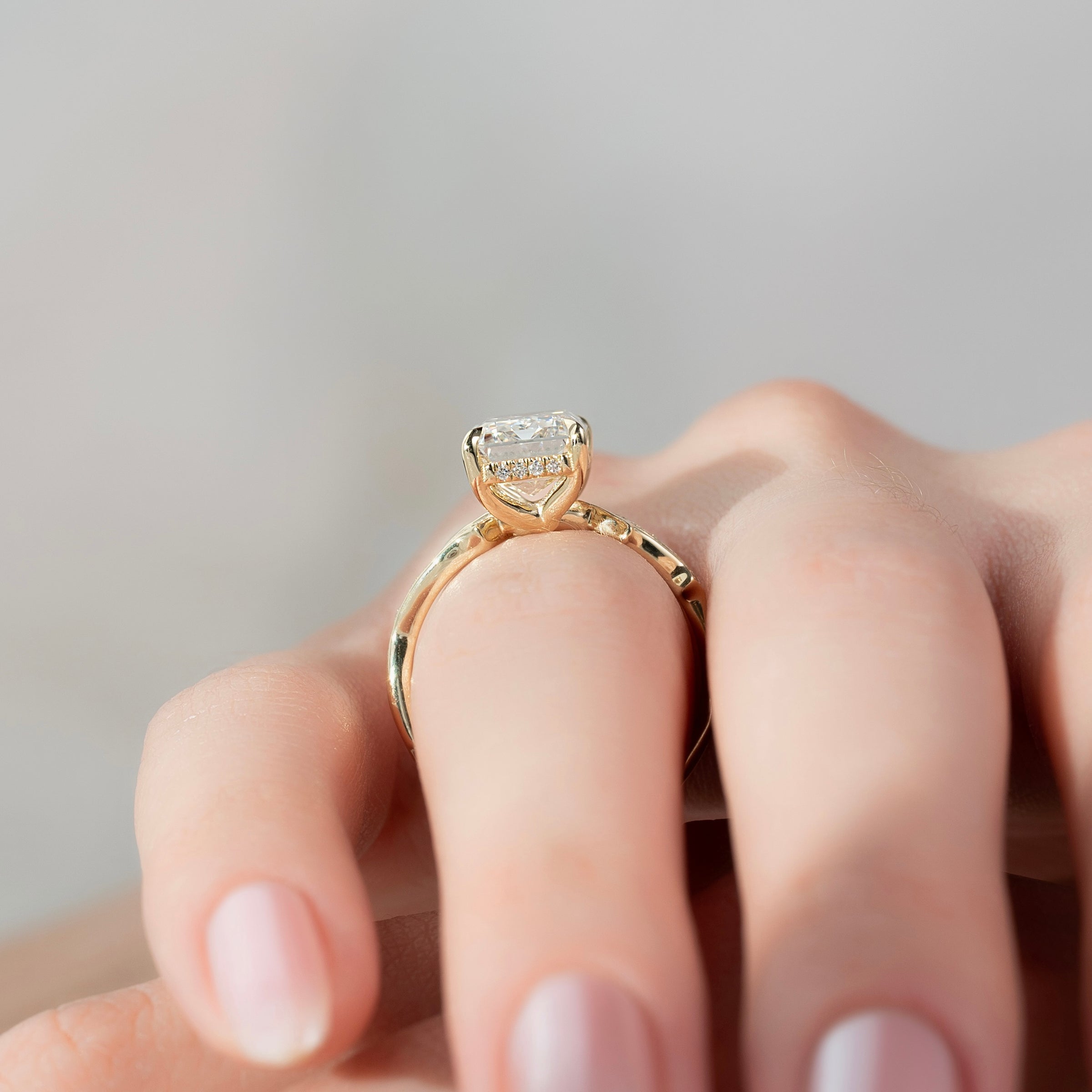 Moonlit 2.50 Carat VVS1 Lab-Grown Emerald Three-Stone Pave Engagement Ring in 18K Yellow Gold Finger View