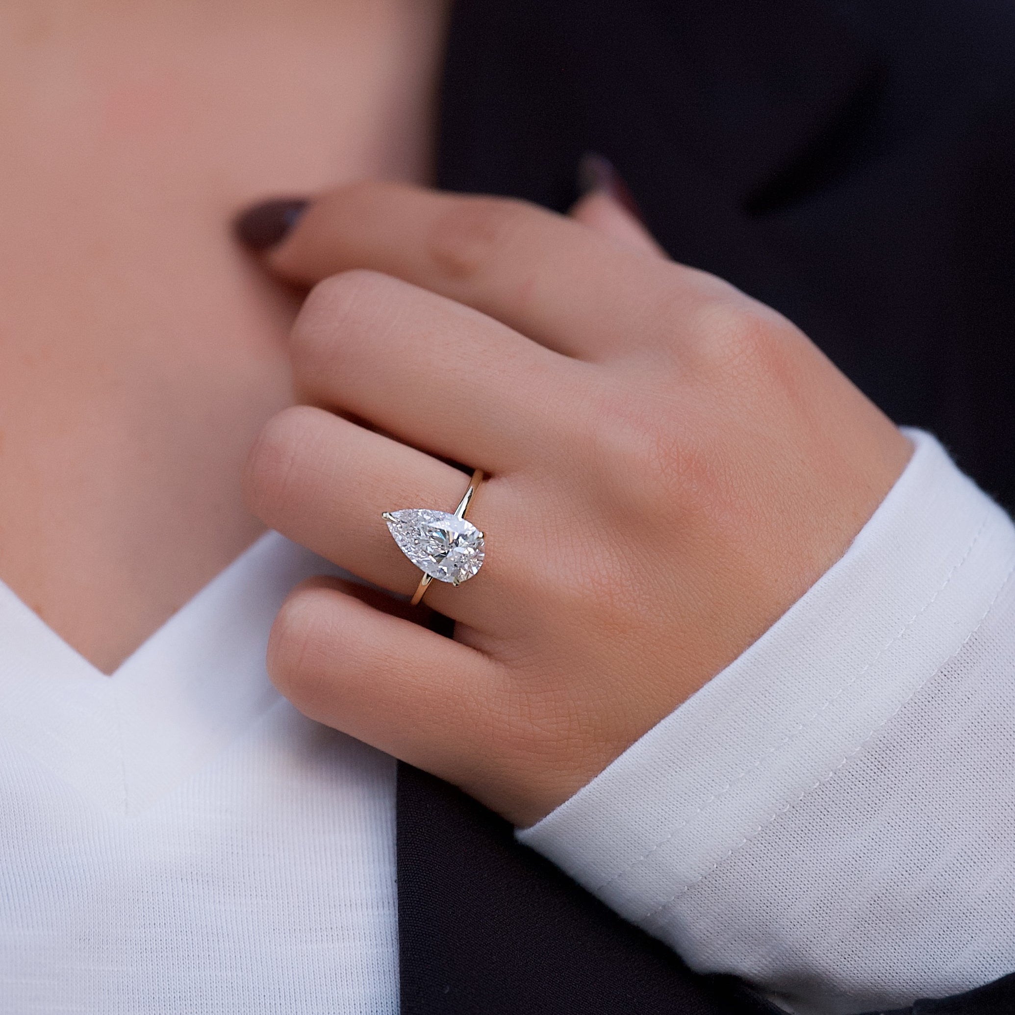 Opal Essence 2.71 Carat VVS1 Lab-Grown Hidden Halo Engagement Ring in 18K Yellow Gold Hand View