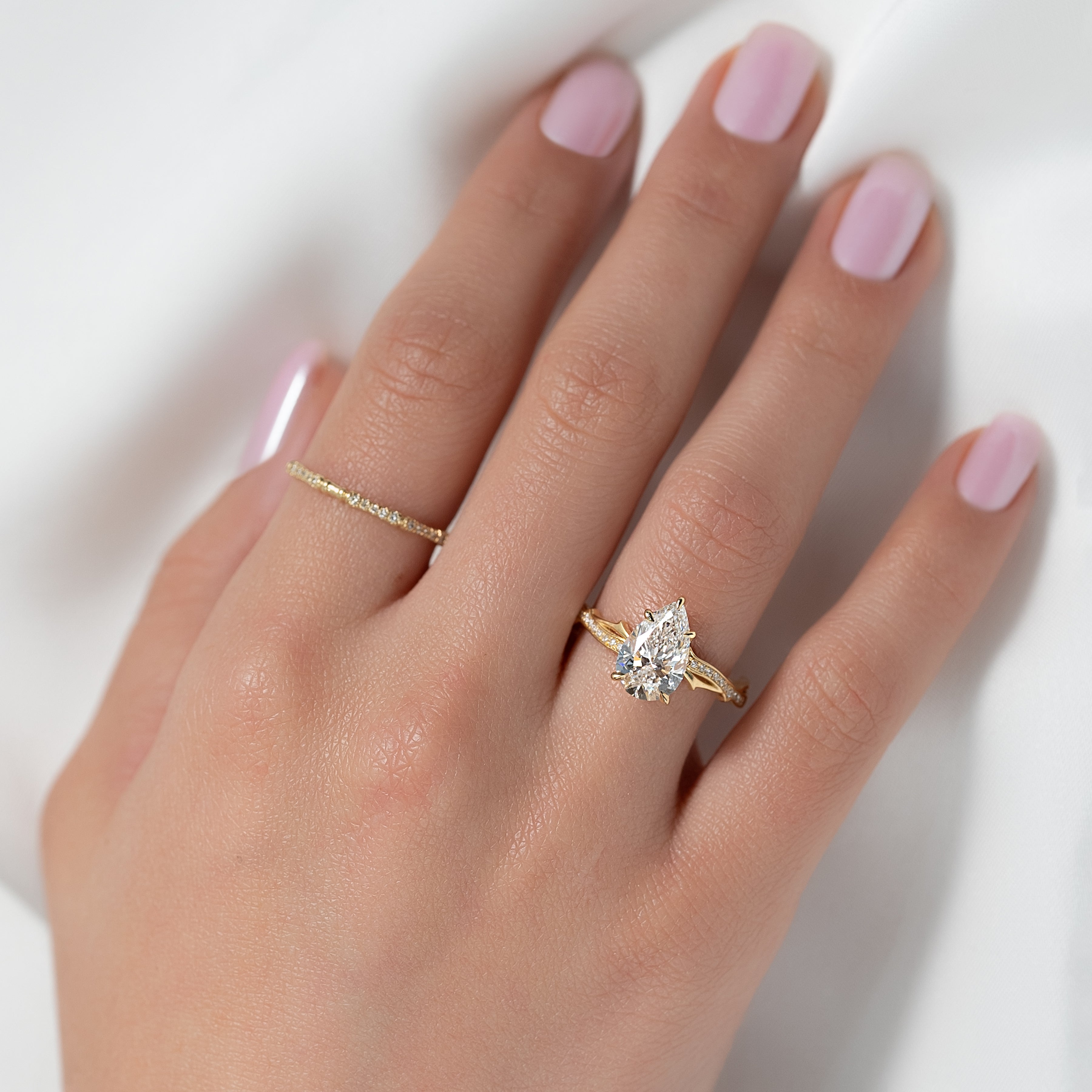 Opulent Cascade 1.50 Carat VVS1 Lab-Grown Pear Pave Engagement Ring in 18K Yellow Gold Finger View