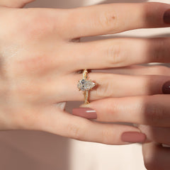 Opulent Cascade 1.50 Carat VVS1 Lab-Grown Pear Pave Engagement Ring in 18K Yellow Gold Hand View