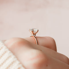 Opulent Glow 3 Carat VVS1 Lab-Grown Hidden Halo Engagement Ring in 18K Rose Gold Finger Closeup View