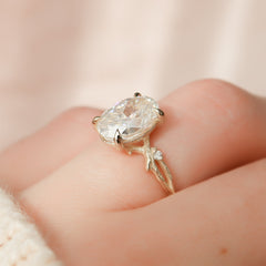 Opulent Serenity 2 Carat VVS1 Lab-Grown Oval Three Stone Ring in 18K Yellow Gold Hand Closeup View