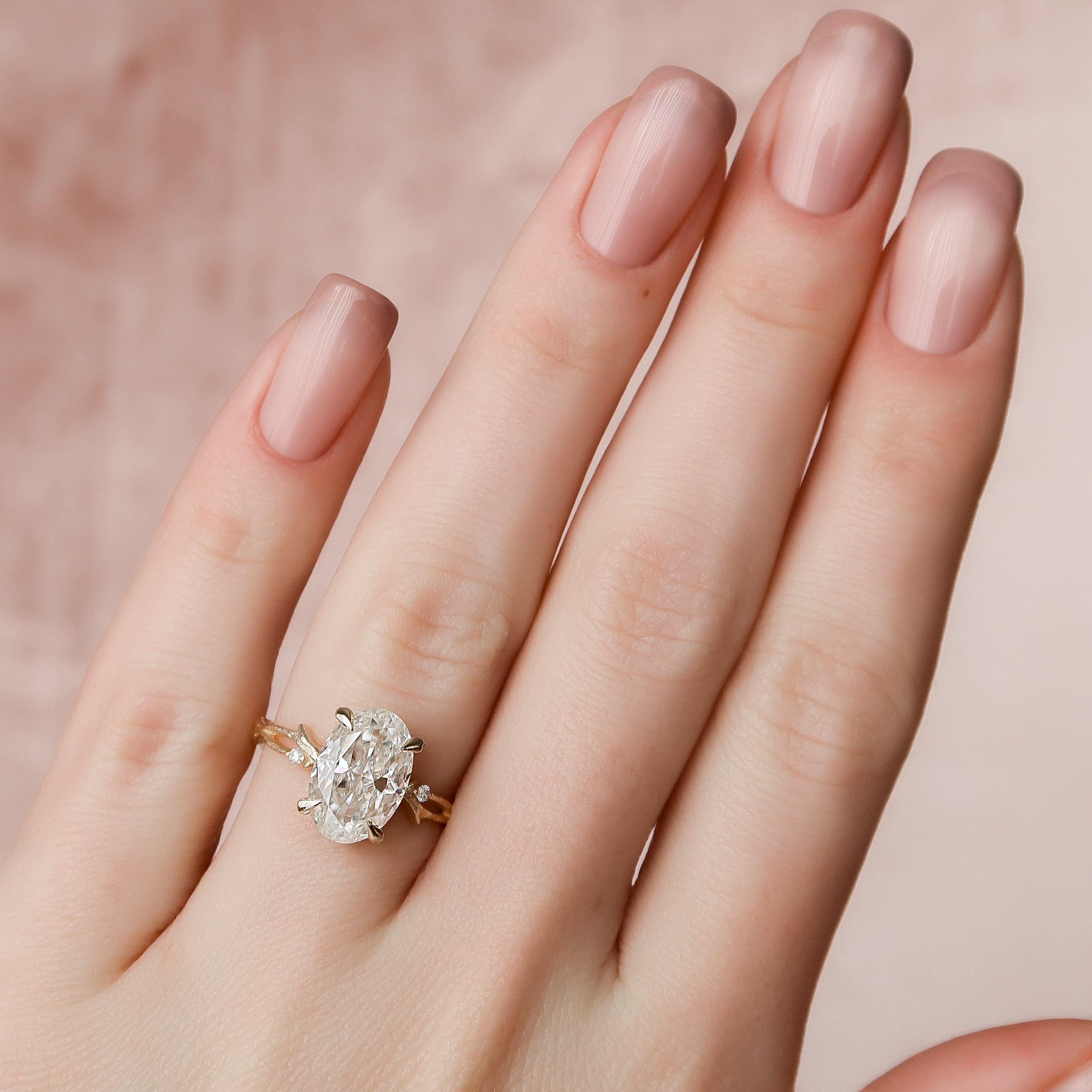 Opulent Serenity 2 Carat VVS1 Lab-Grown Oval Three Stone Ring in 18K Yellow Gold Hand View