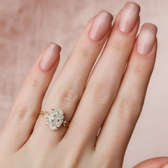 Opulent Serenity 2 Carat VVS1 Lab-Grown Oval Three Stone Ring in 18K Yellow Gold Hand View