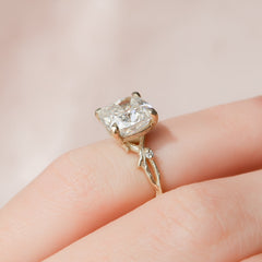 Prismatic Whisper 1.05 Carat VVS1 Lab‑Grown Cushion Textured Three Stone Ring in 18K Yellow Gold Hand Closeup View