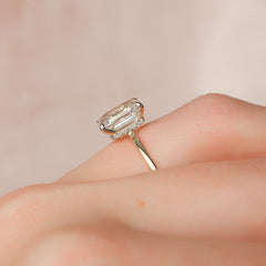 Regal Prism Emerald 2.52 Carat VVS1 Lab-Grown Hidden Halo Engagement Ring in 18K Yellow Gold Finger Closeup View