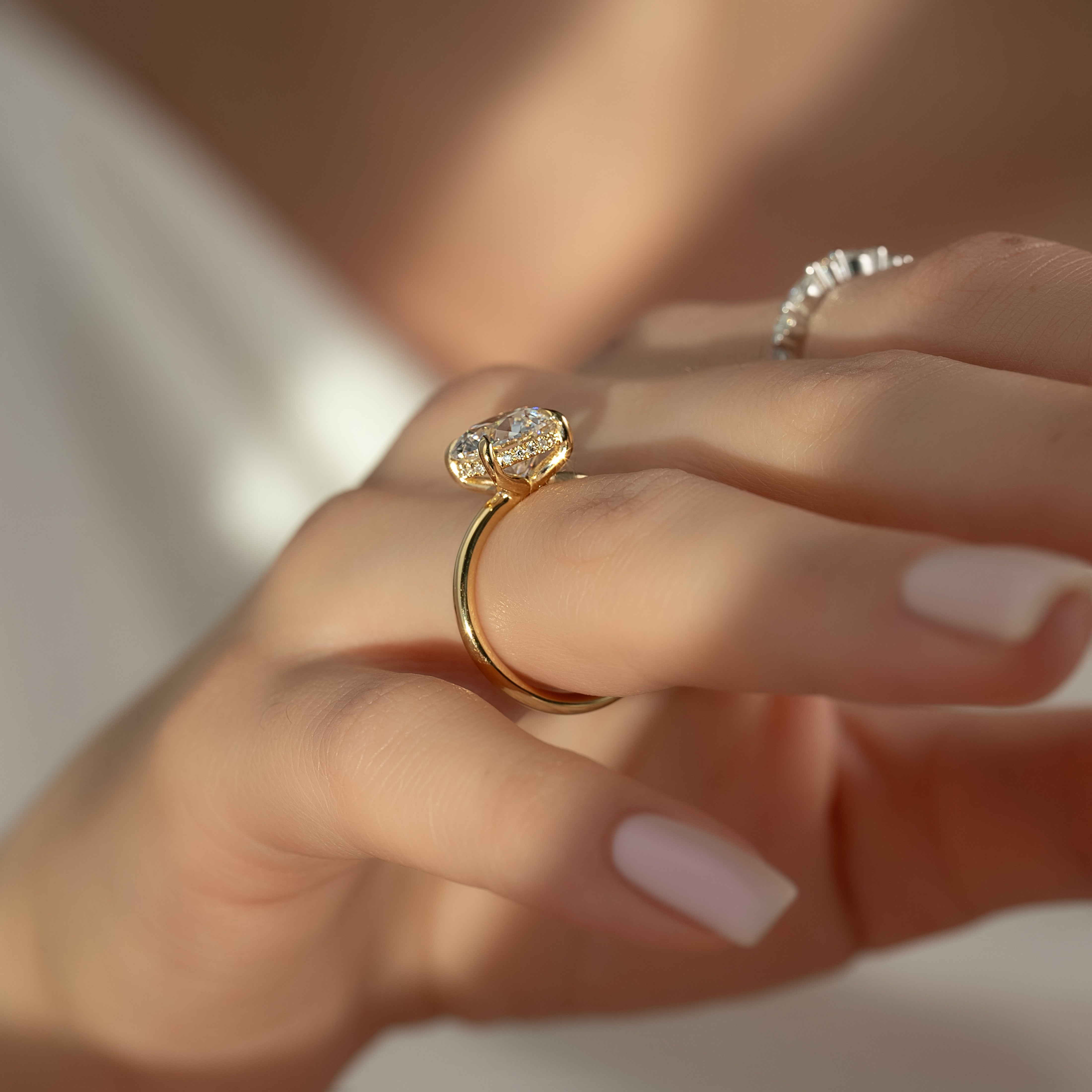 Stellar Round 2.50 Carat VVS1 Lab‑Grown Hidden Halo Engagement Ring in 18K Yellow Gold Finger View