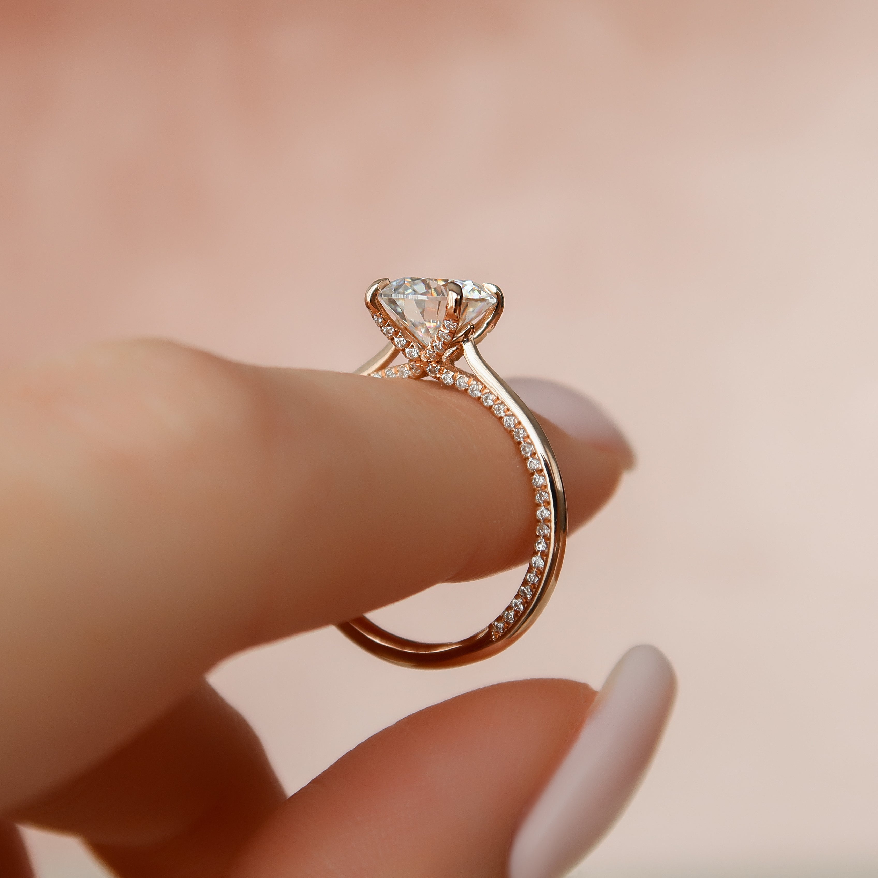 Stellar Whisper 2 Carat VVS1 Lab-Grown Round Solitaire With Accents Engagement Ring in 18K Rose Gold Finger Stand View
