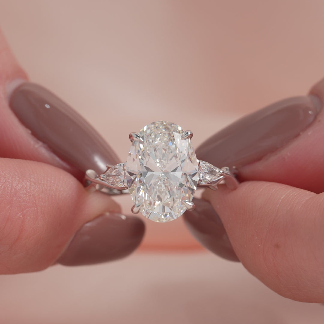 Timeless Elegance 1.58 Carat VVS1 Lab-Grown Oval Three Stone Engagement Ring in 18K White Gold
 Closeup View