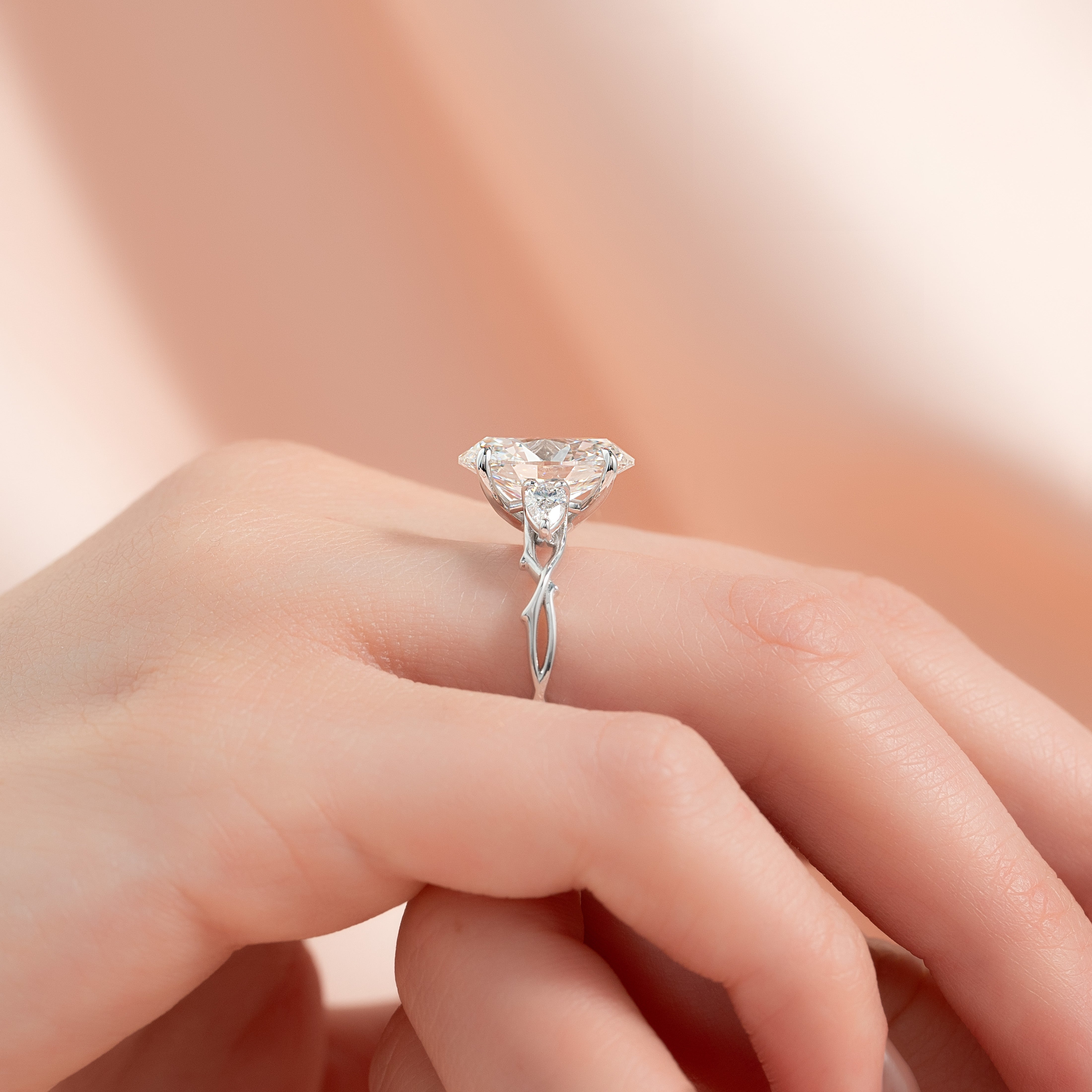 Timeless Elegance 1.58 Carat VVS1 Lab-Grown Oval Three Stone Engagement Ring in 18K White Gold
Finger Side View