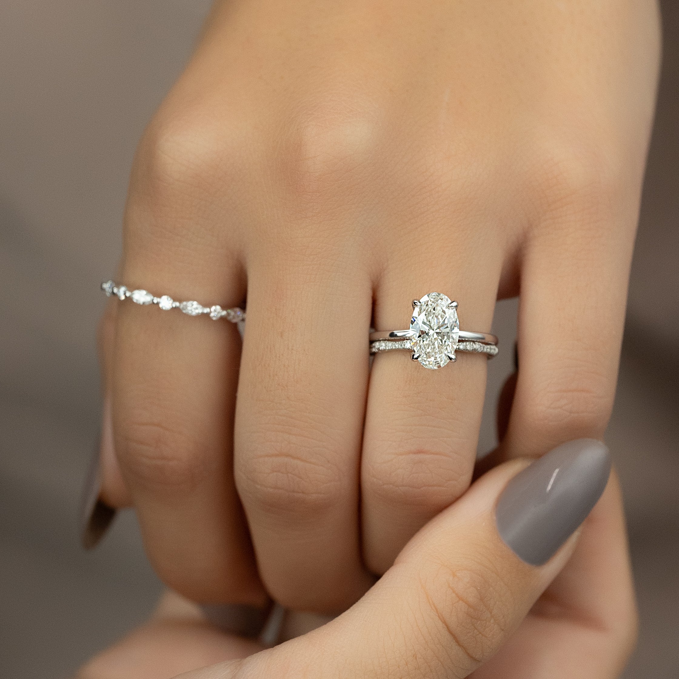 Timeless Oval 2.09 Carat VVS1 Lab-Grown Hidden Halo Engagement Ring in 18K White Gold Hand View