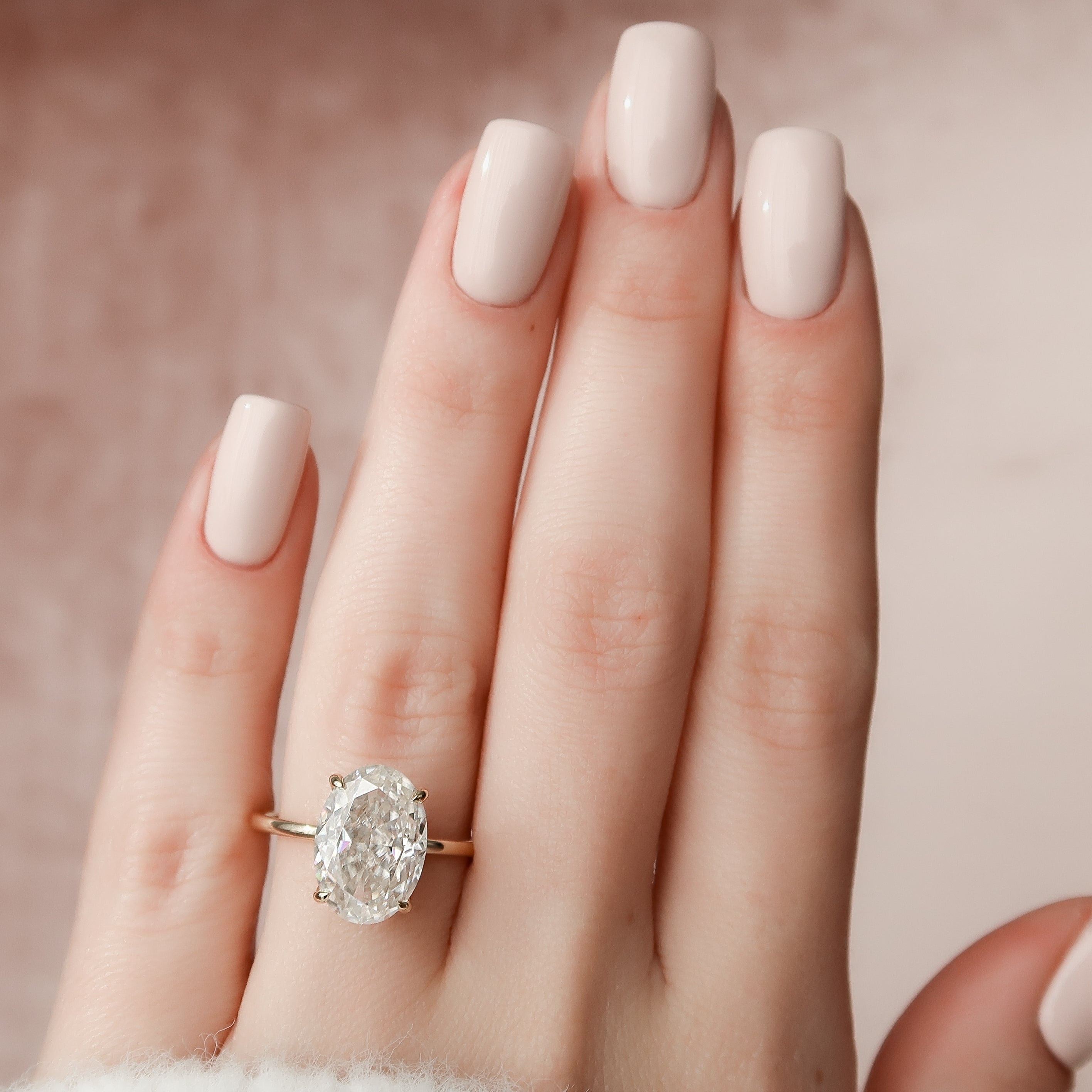 Timeless Oval 2.09 Carat VVS1 Lab-Grown Hidden Halo Engagement Ring in 18K Yellow Gold Finger View